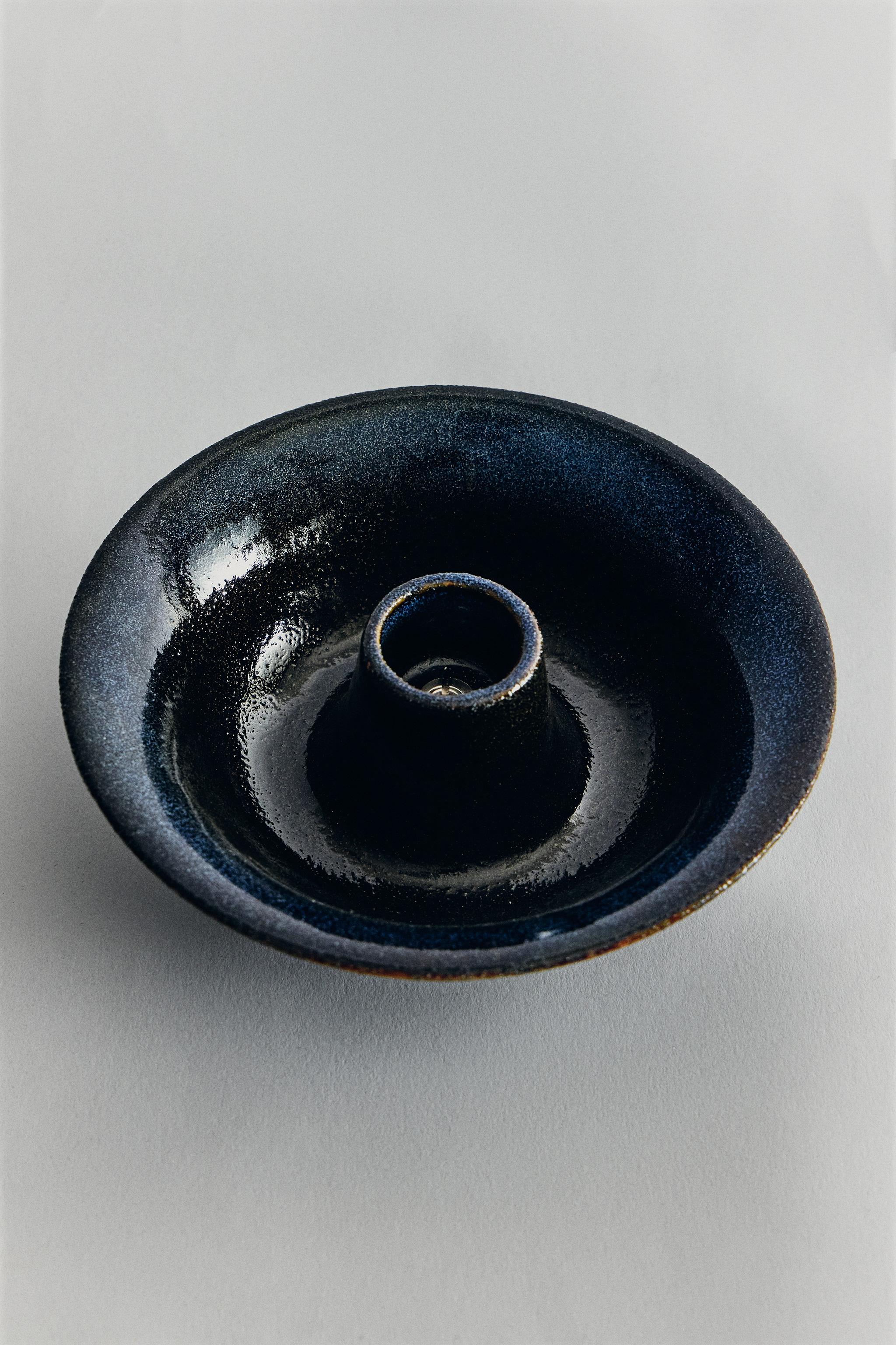IRON AND STONEWARE CANDLEHOLDER